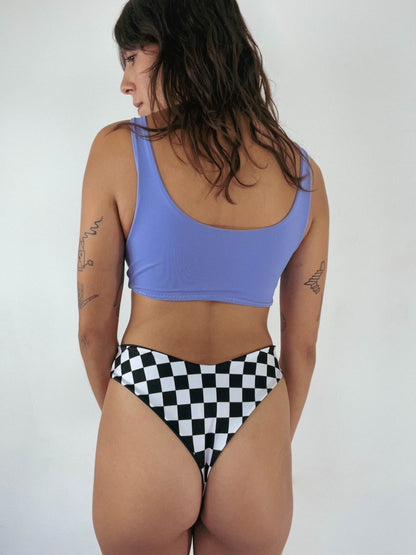 custom reversible swim bottoms on a model in jett style