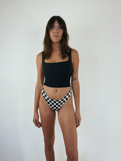 custom reversible swim bottoms on a model in jett style