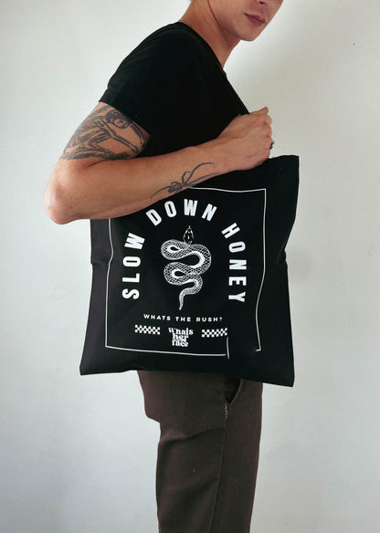 Black tote bag with snake and slow down honey graphic