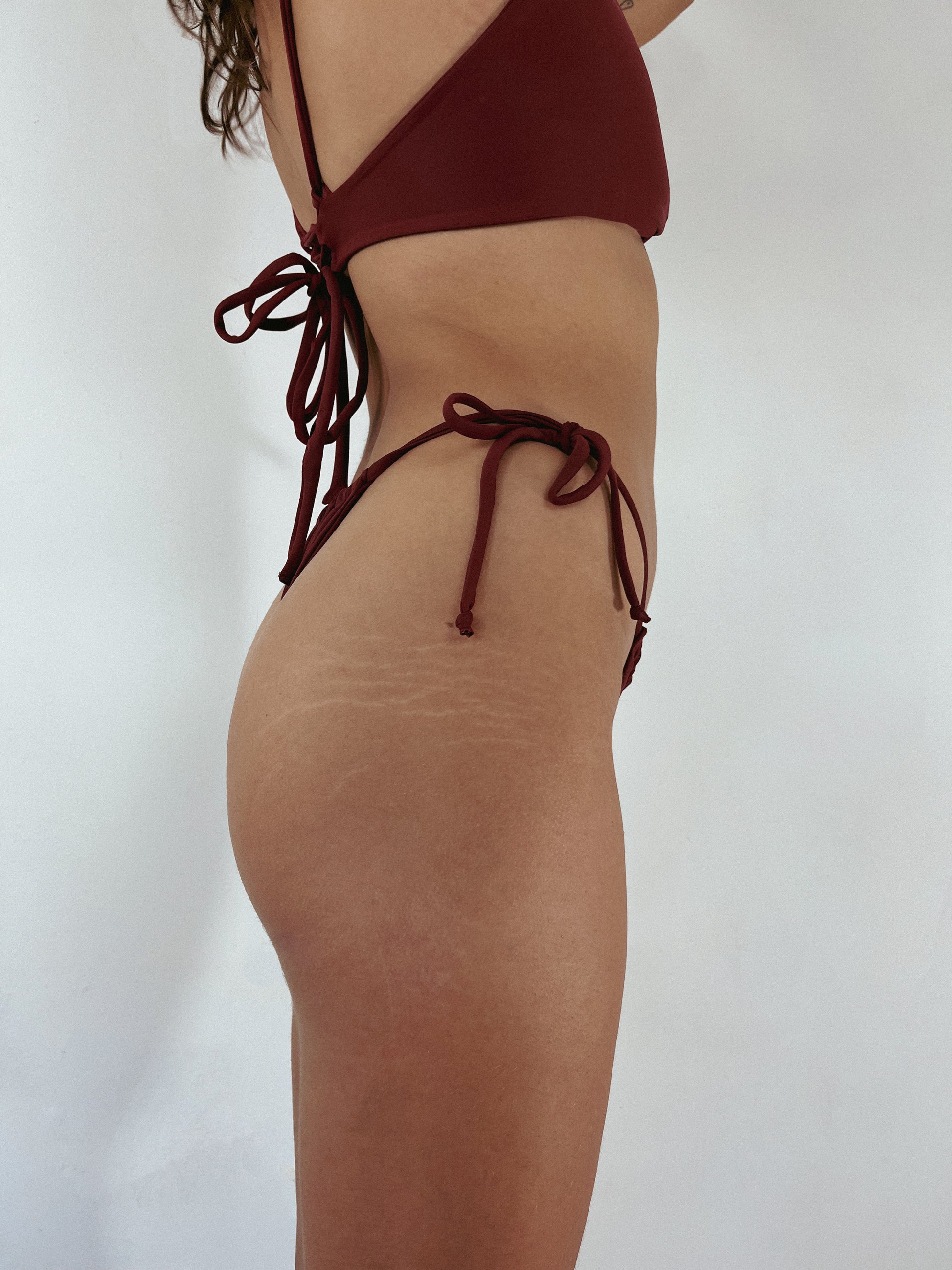 reversible slim chance swimwear bottoms shown in rose red