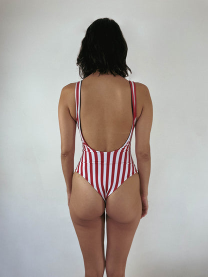 cheeky one piece swimsuit. custom reversible swimwear in red and white stripe