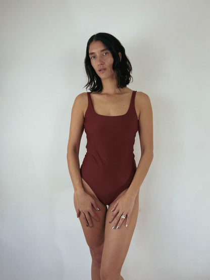 cheeky one piece swimsuit. custom reversible swimwear in rose red