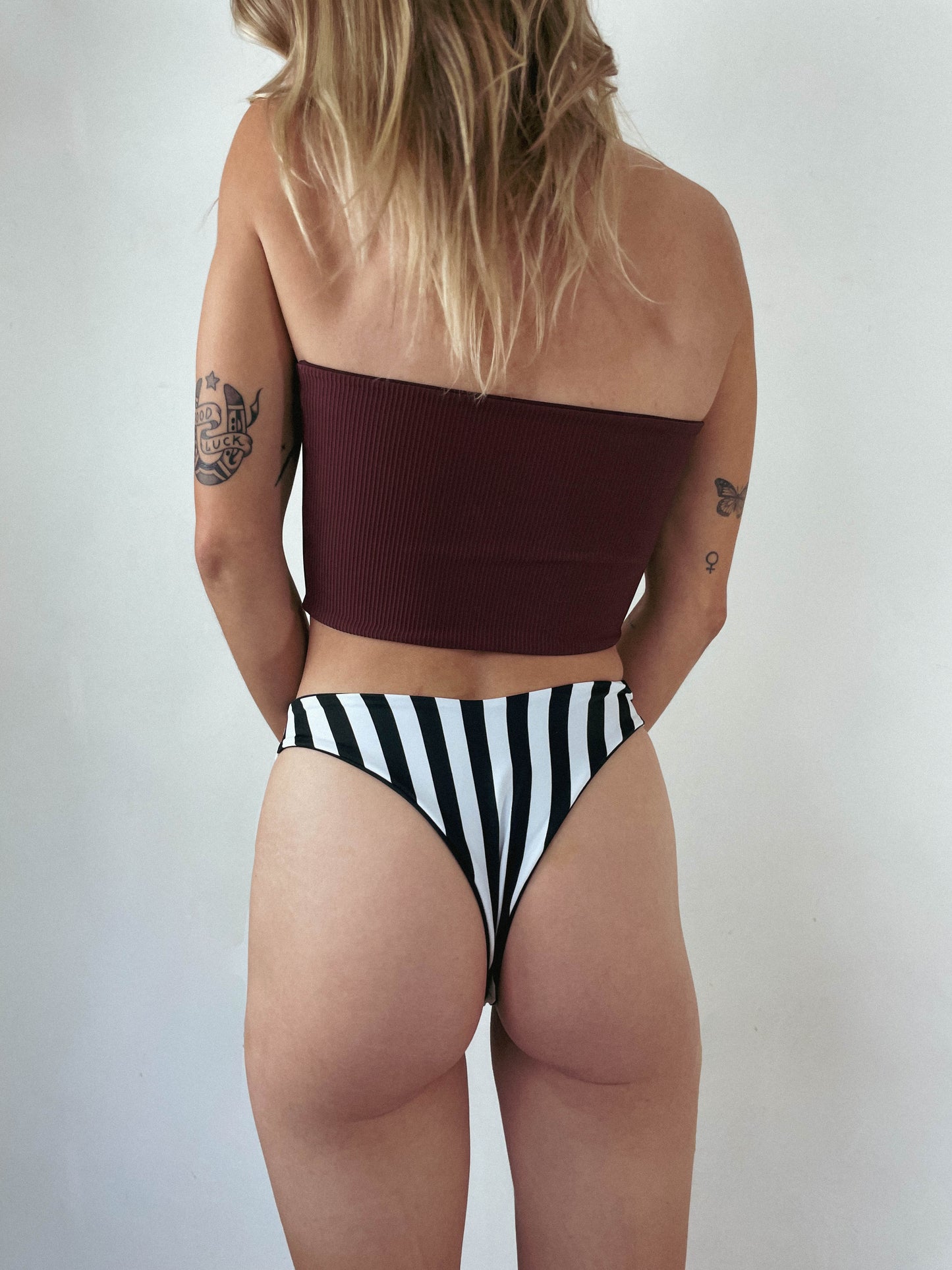 custom reversible swim bottoms on a model in jett style